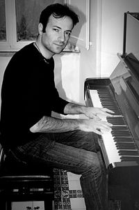 Portrait of smiling man playing piano