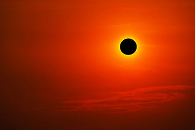 Low angle view of moon at sunset