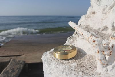 Close-up of water on beach against sky