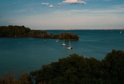 High angle view of sailboat by sea against sky