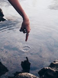 Woman touching water