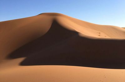 Scenic view of desert against clear sky