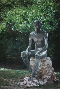 Statue against trees in park