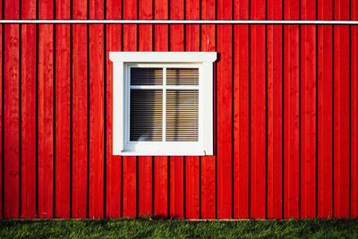 Full frame shot of window with red shutter