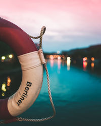 Close-up of life belt against sky at night
