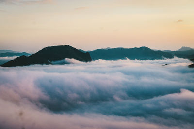 Scenic view of mountains against sky during sunset