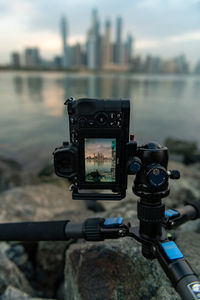 Close-up of camera on riverbank