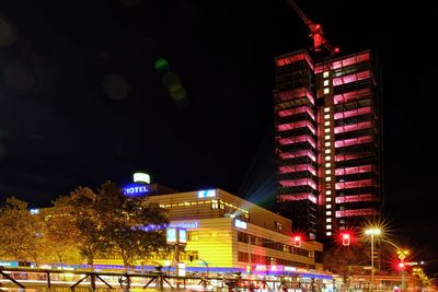 Illuminated buildings in city at night