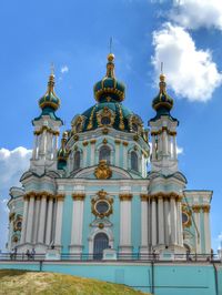 Low angle view of built structure against blue sky