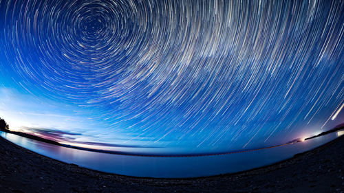 Light trails in sky at night