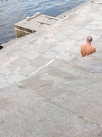 High angle view of man standing on shore