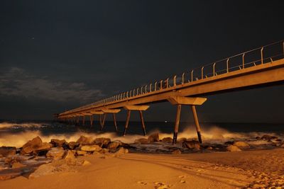 Horse cart on road against sky at night