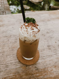 Espresso coffee with whipped cream and parsley