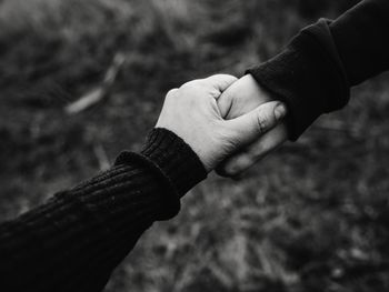 Close-up of man holding hands