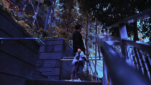 Low angle view of woman walking on staircase