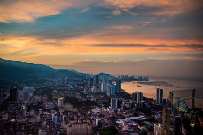 High angle view of buildings against sky during sunset