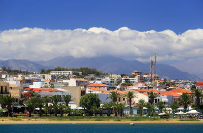 View of calm sea against built structures