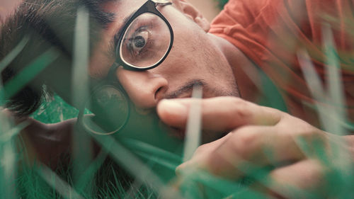 Close-up portrait of young man with eyeglasses