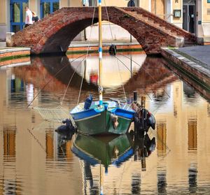 Boats moored in lake