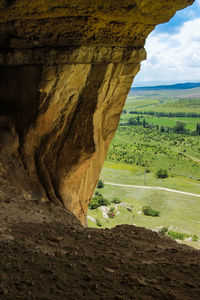 Rock formation on land against sky