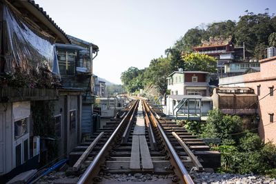 Railroad track leading to building