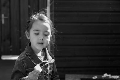 Portrait of cute girl holding ice cream