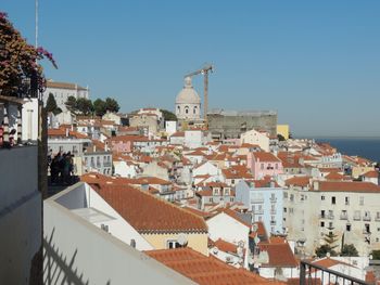 Buildings in historic town against clear sky