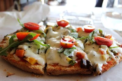 Close-up of pizza served on table