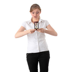 Portrait of young man standing against white background