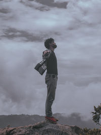 Full length of man standing on mountain