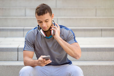 Mid adult man using mobile phone