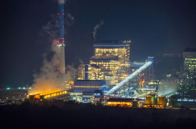 Illuminated buildings in city at night