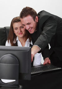 Young man using laptop in mobile phone