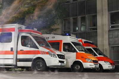 View of vehicles on road along buildings