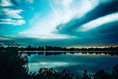 Scenic view of lake against sky during sunset