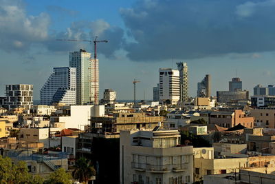 Modern buildings in city against sky