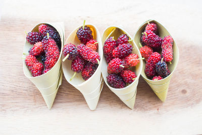 High angle view of strawberries on table