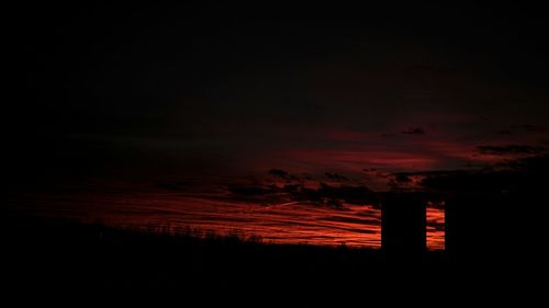 Silhouette of trees against sky at sunset