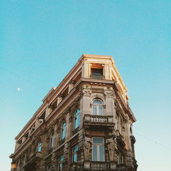 Low angle view of building against clear blue sky
