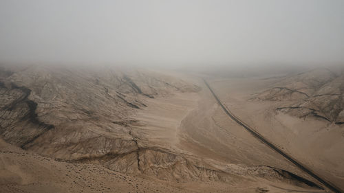 Scenic view of desert against clear sky