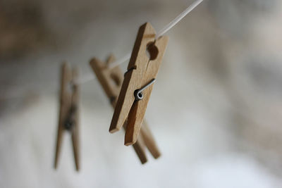 Close-up of clothespins on clothesline