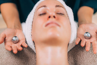 Close-up of woman getting massage therapy at spa