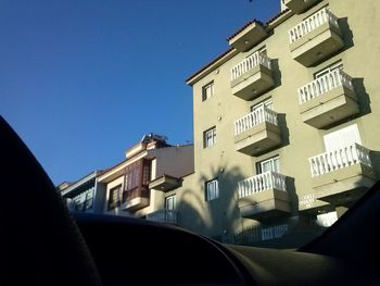 Low angle view of building against blue sky