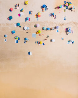 Top down view from a beach with beach umbrellas