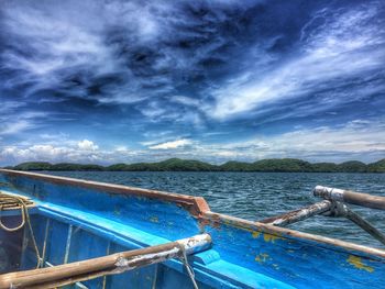 Boats sailing in sea against sky