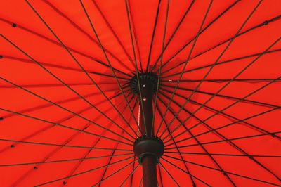 Low angle view of red umbrella against sky