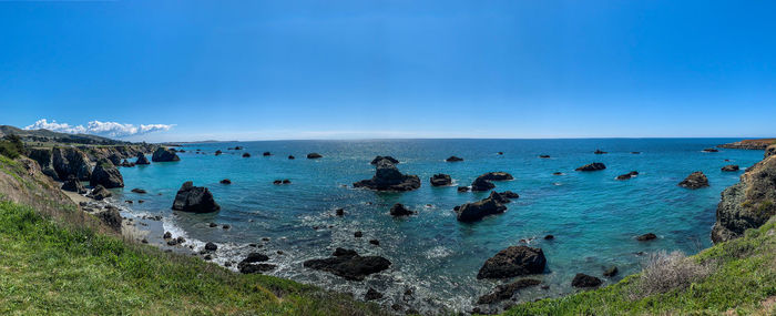 Scenic view of sea against blue sky