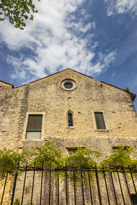 Low angle view of old building against sky