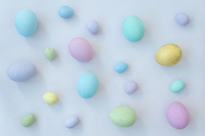 Directly above shot of multi colored candies on blue background