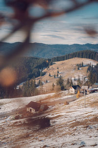 Scenic view of landscape against sky during winter